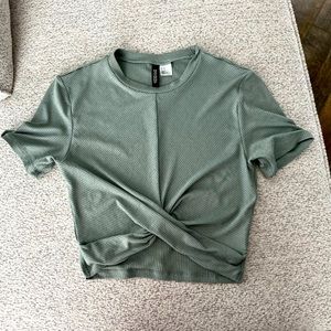 Green crop top with little ruffle in the front!